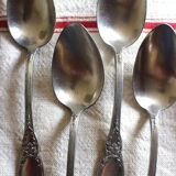 A set of 6 silver-plated metal soup spoons with foliage design.