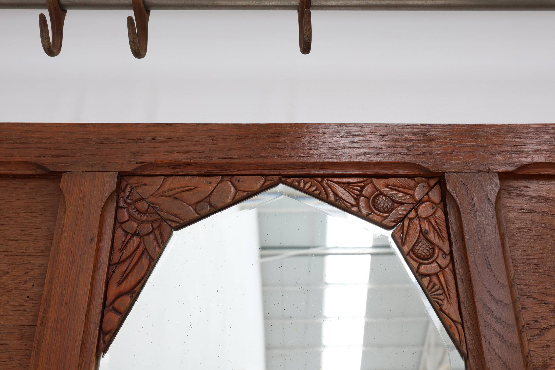 Art Deco oak carved wall coatrack with mirror, France 1920s