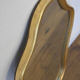 Golden mirror in wood and gold leaf