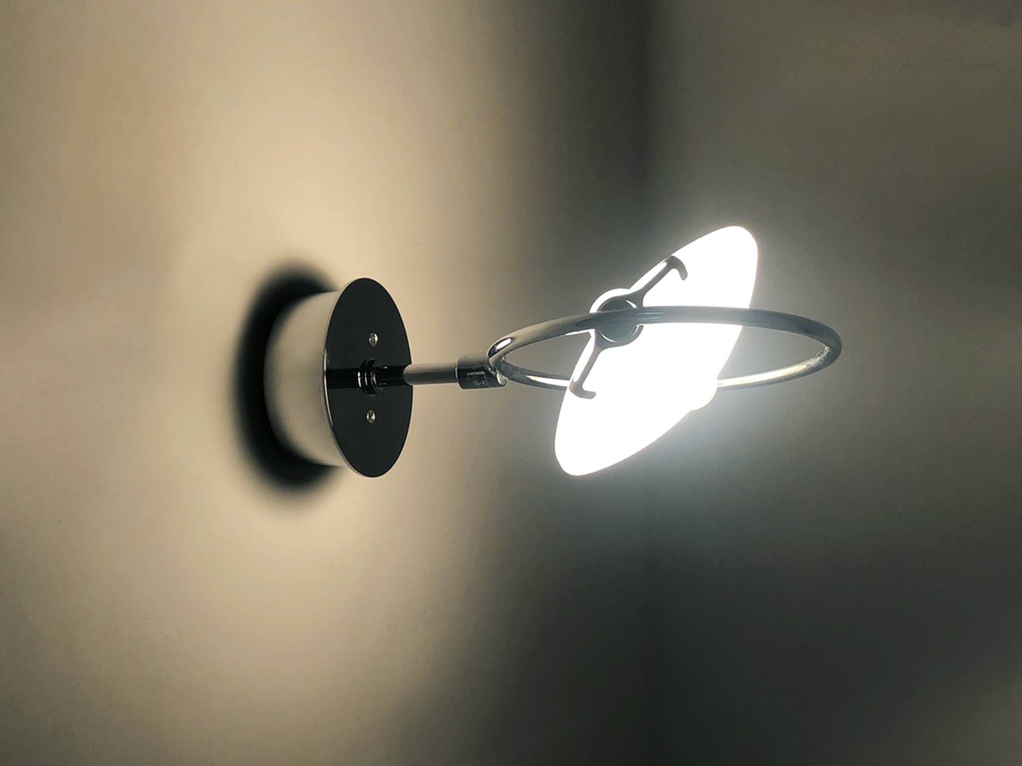 Pair of Italian Fontana Arte Nobi wall lights in chrome metal and satin glass.