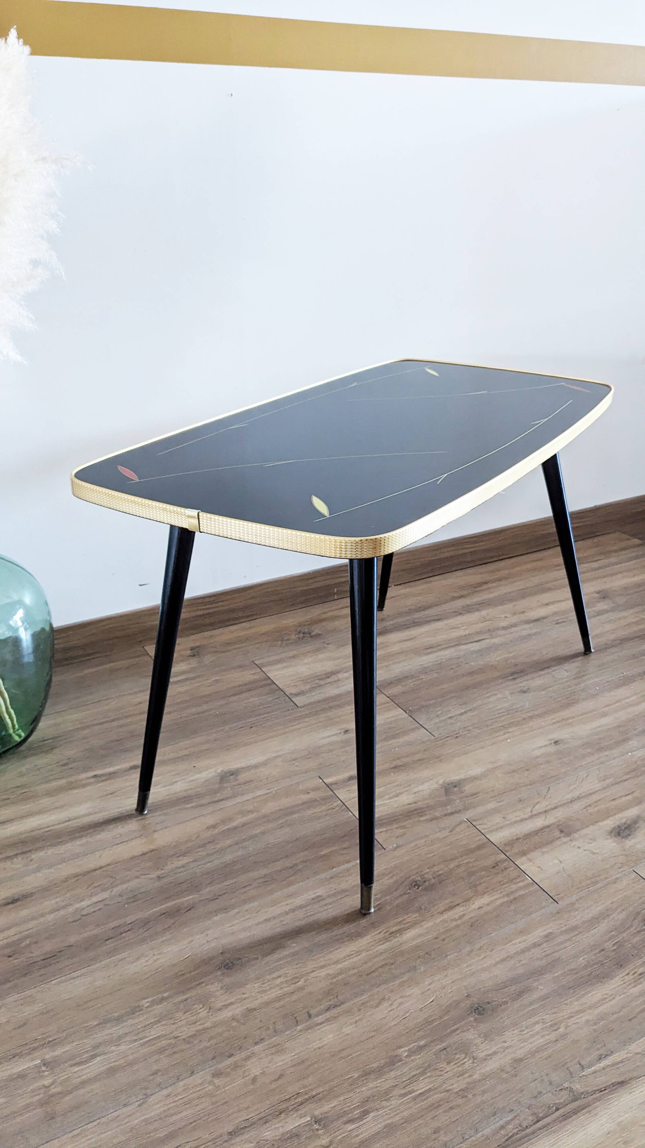 Glass coffee table with spindle legs