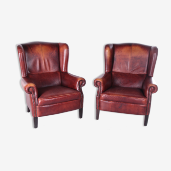 Set of two High Ear Armchairs Sheepskin with a beautiful brown patina