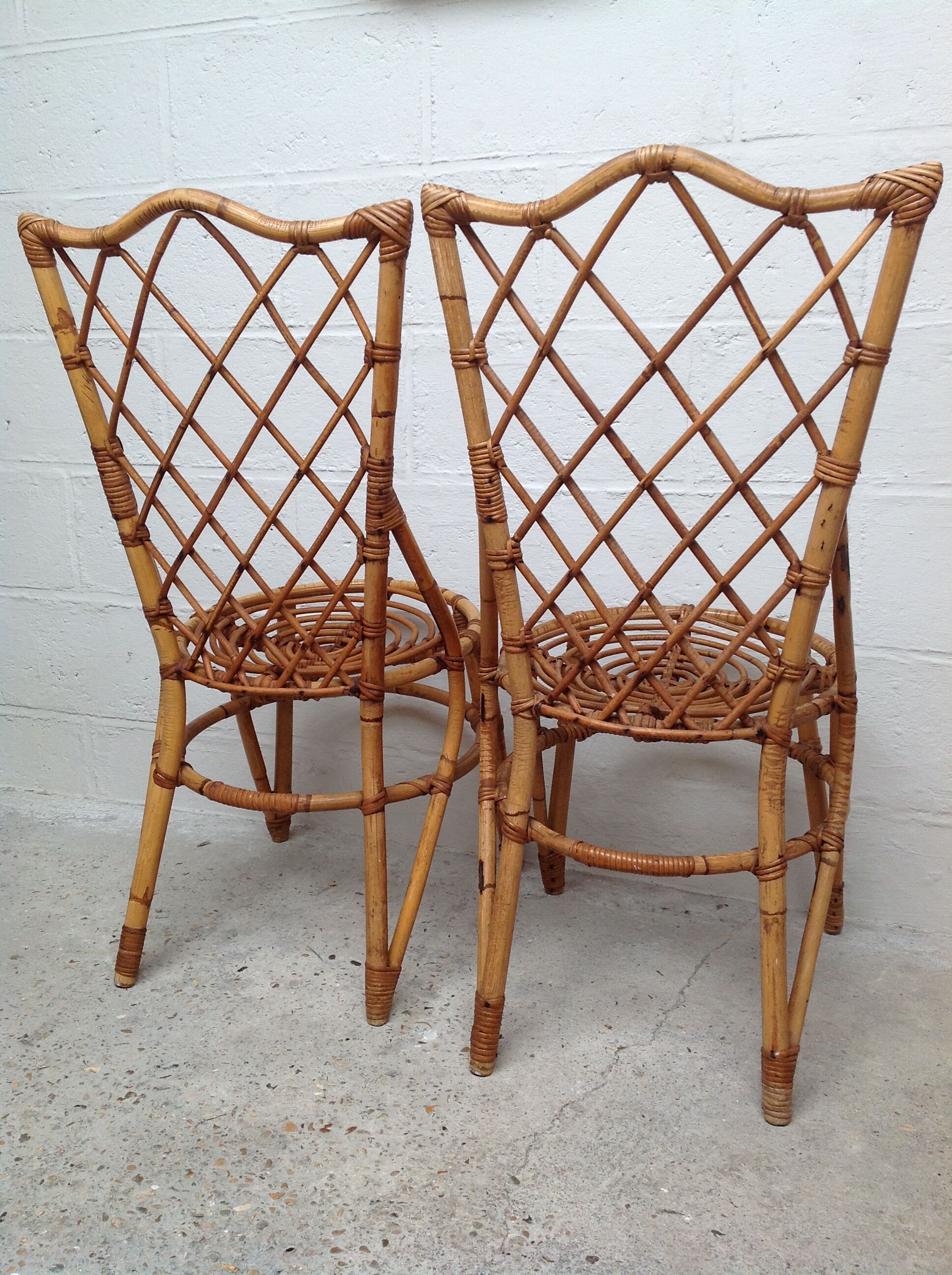 Pair of rattan chairs by Louis Sognot