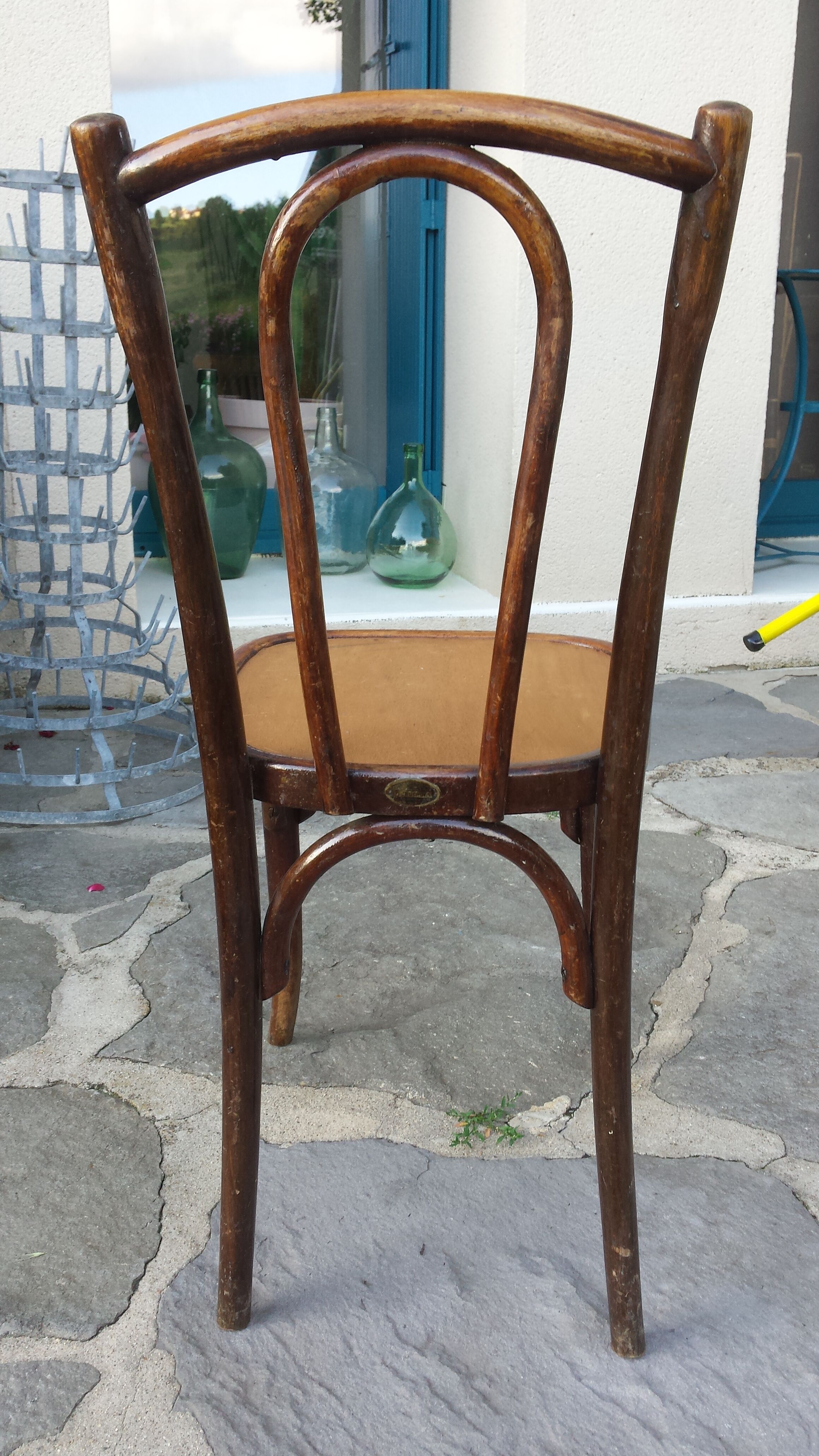 Bistro chair with buchon brand plate