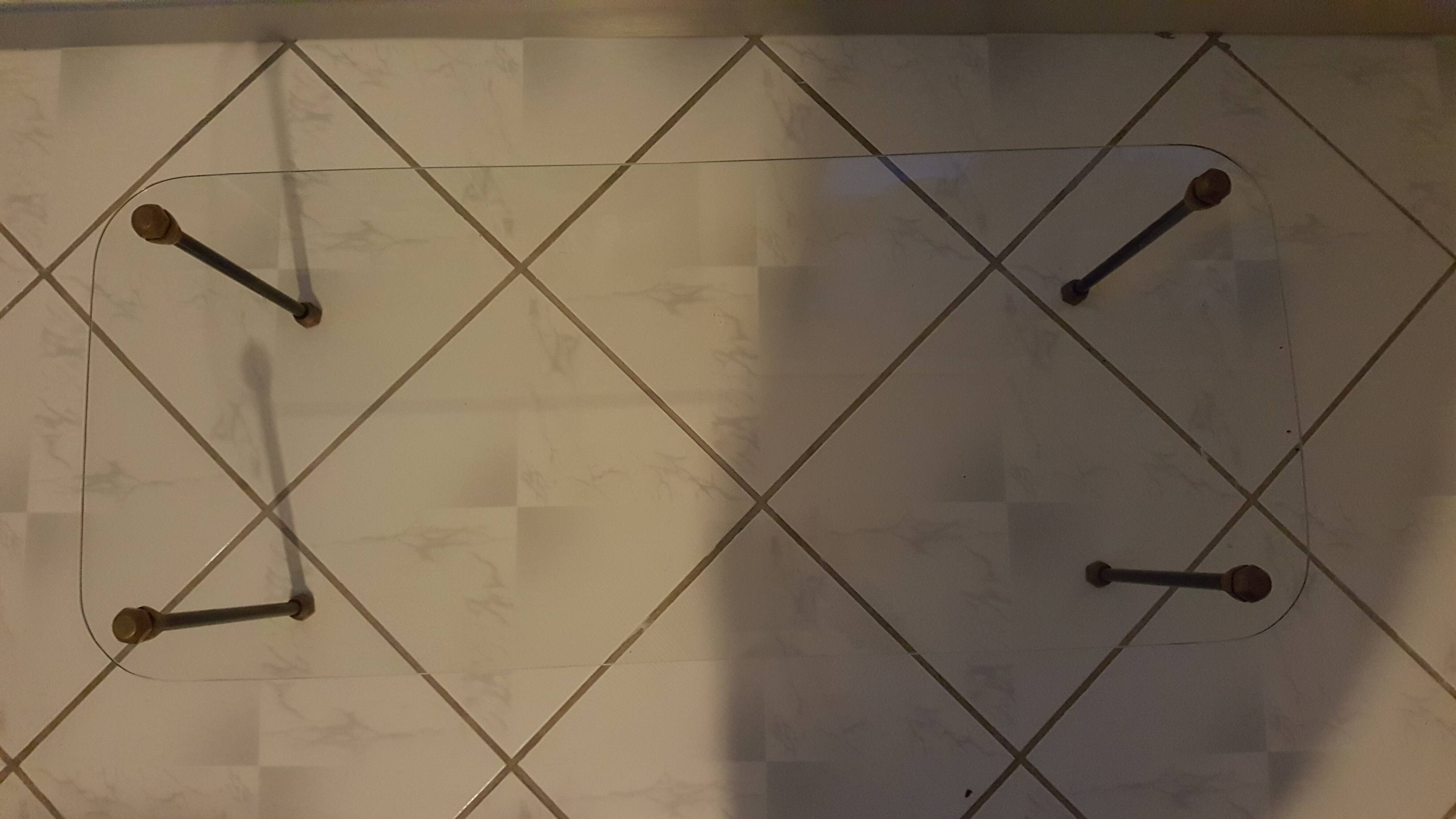 Glass table with brass tip