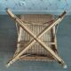 Fauteuil vintage en rotin tressé.