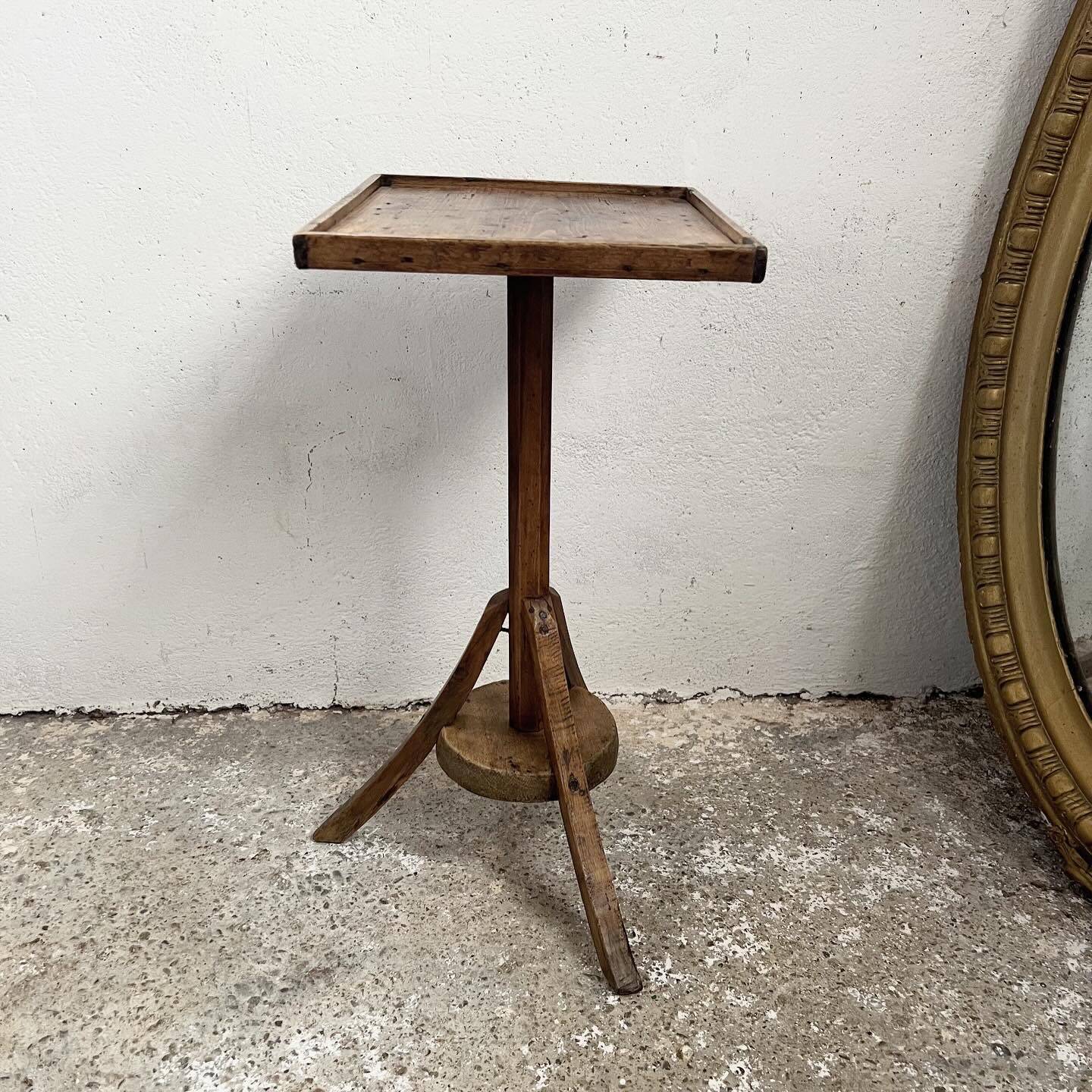 Old primitive wooden tripod pedestal table