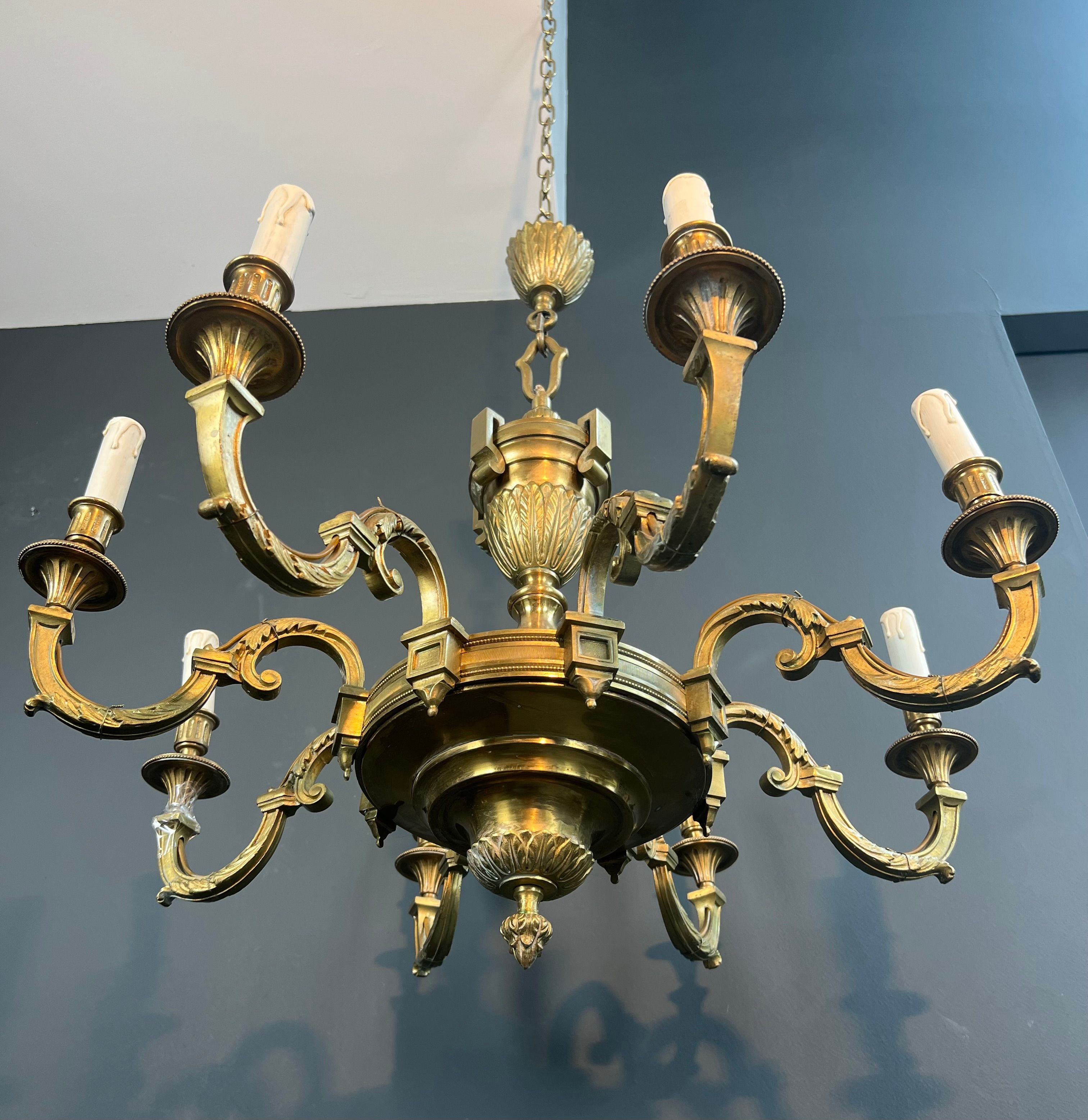 Important Louis XVI style chiseled bronze chandelier with 8 light arms by Lucien Gau