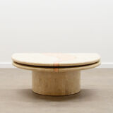 Travertine coffee table with swiveling top.
