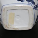 A pair of Chinese blue and white ovoid vases and flush-fitting circular covers