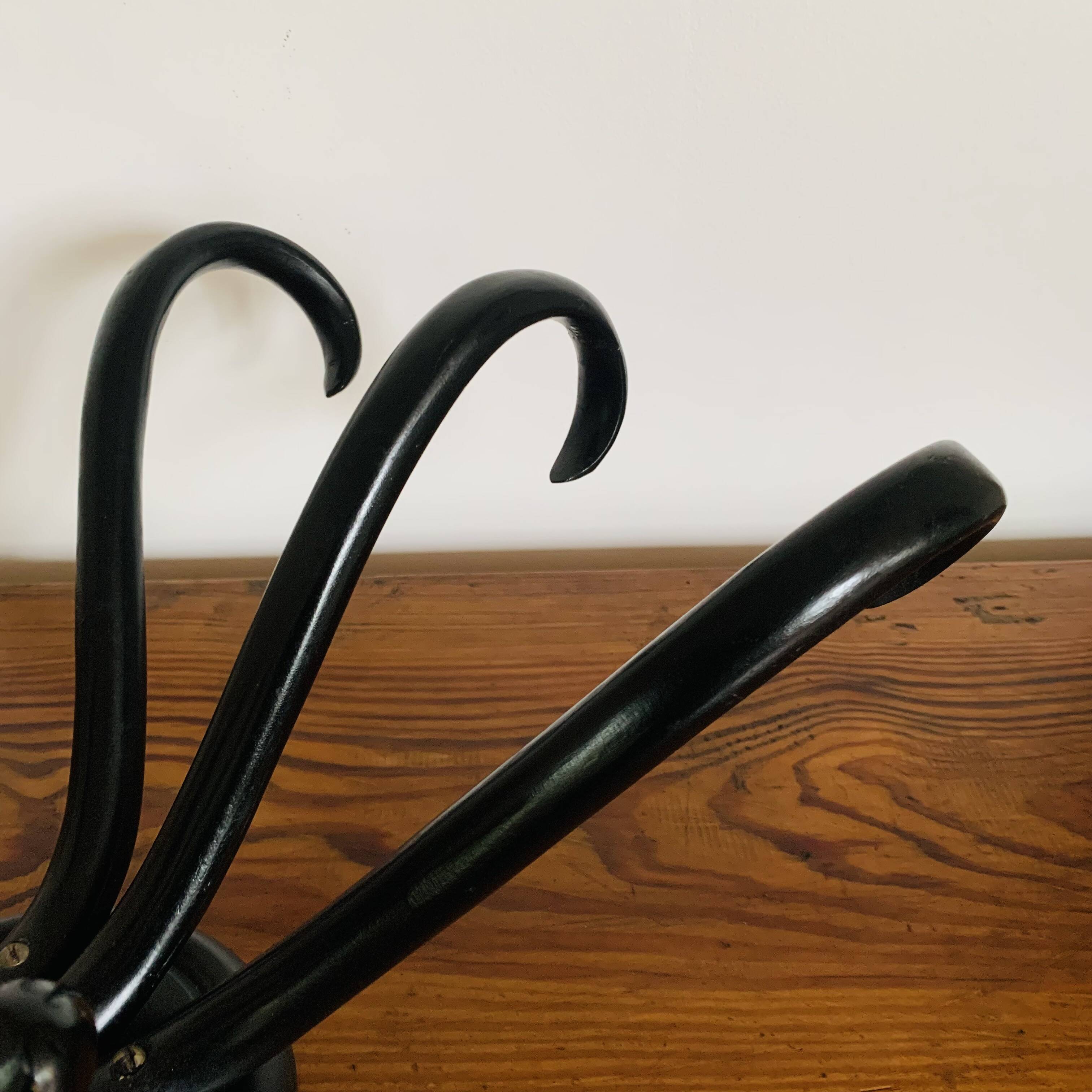 Wall-mounted coat rack with 3 hooks