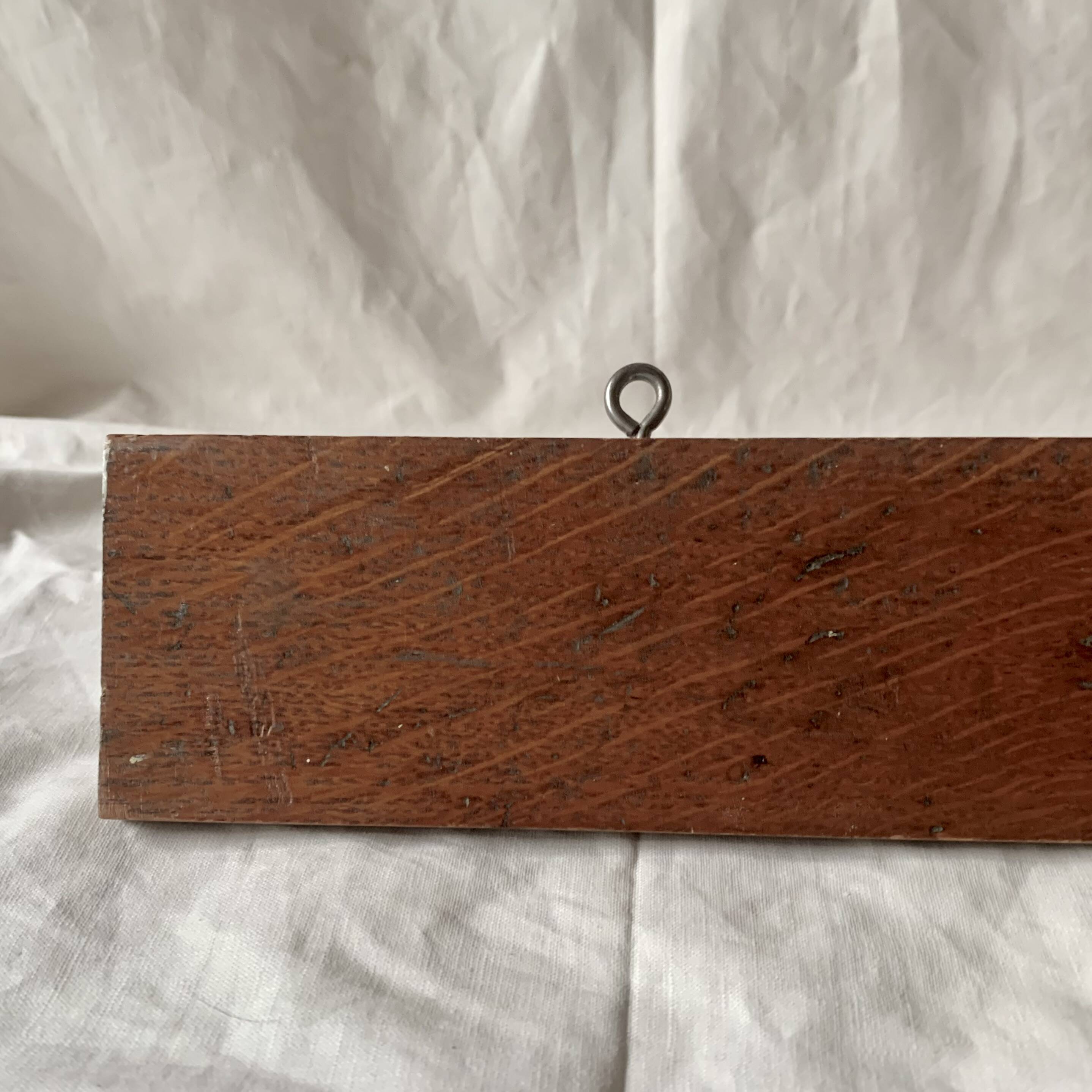 Vintage wooden wall-mounted coat rack with three double hooks