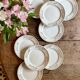 Set of 8 vintage white and gold dessert plates.