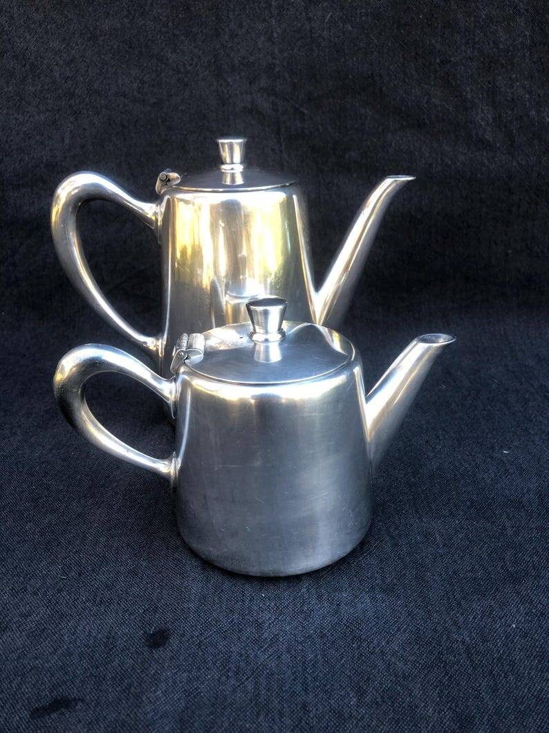A pair of vintage silver-plated teapot and coffee pot