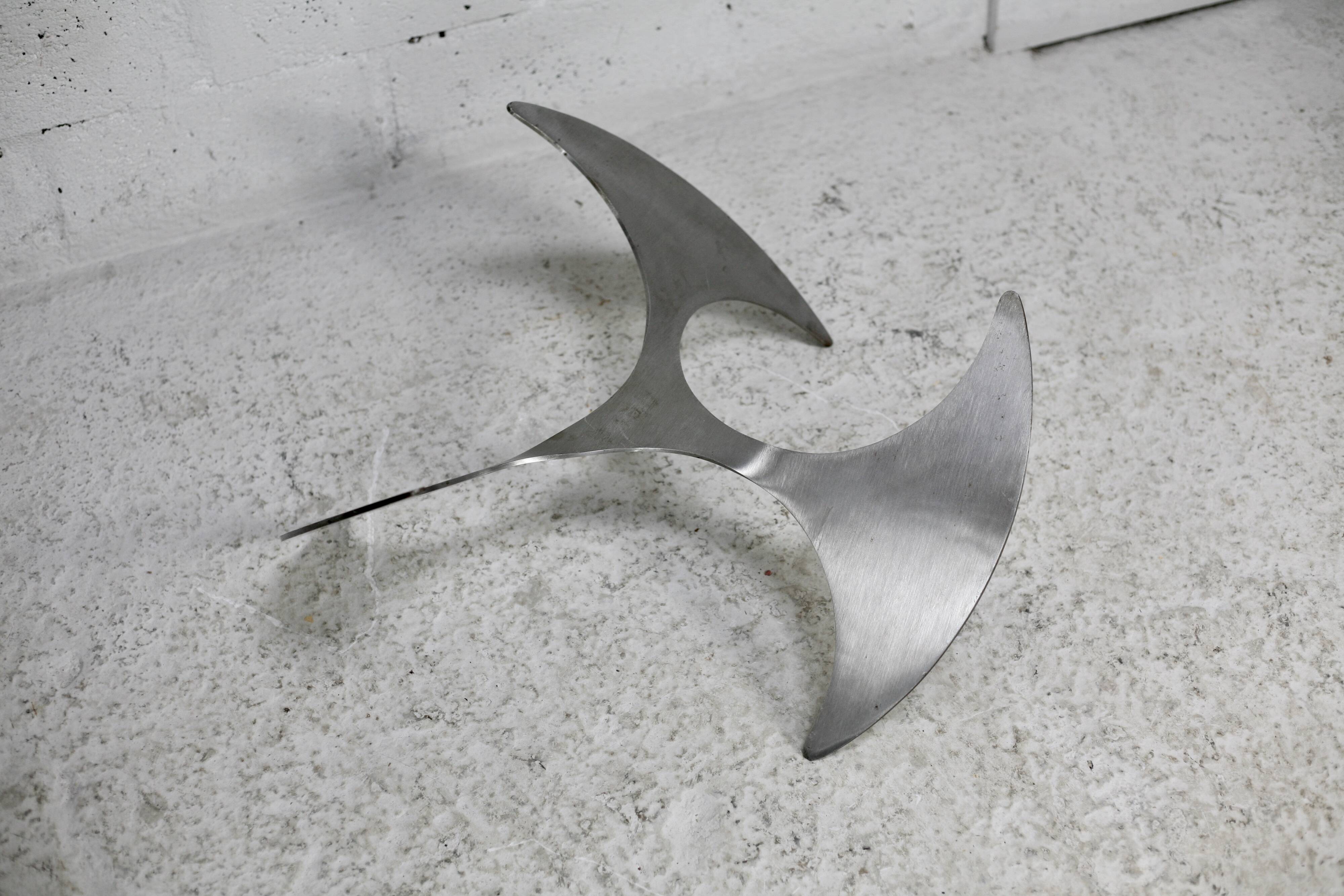 "space age" coffee table. Steel legs, glass slab. Circa 1970