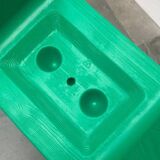 Postmodern plastic stool with a wood effect.