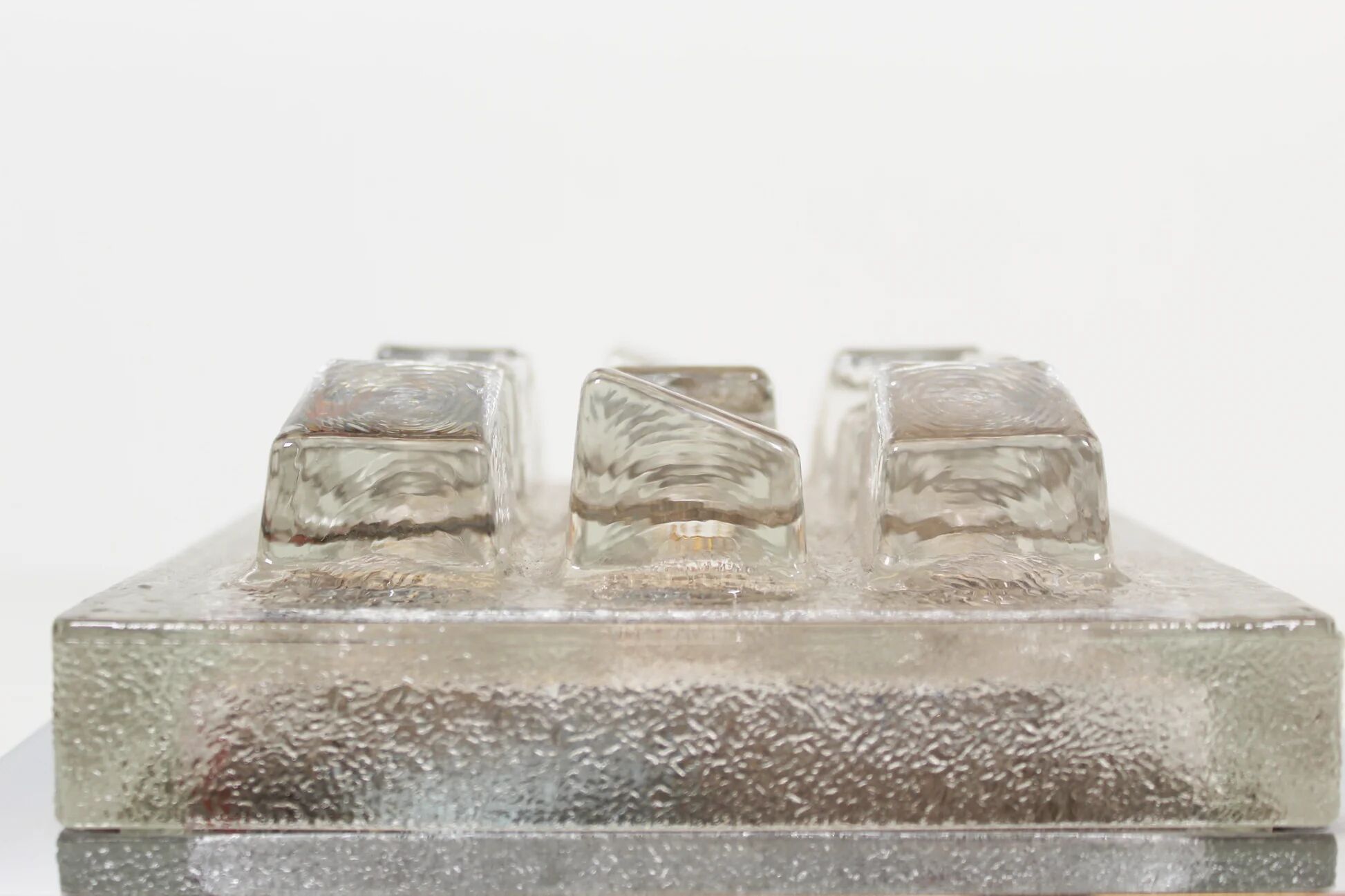 Single 1970s brutalist glass wall sconce by Hillebrand