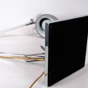 Table lamp of stainless steel and of italian design by Flos