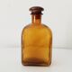 Vintage amber glass apothecary bottle