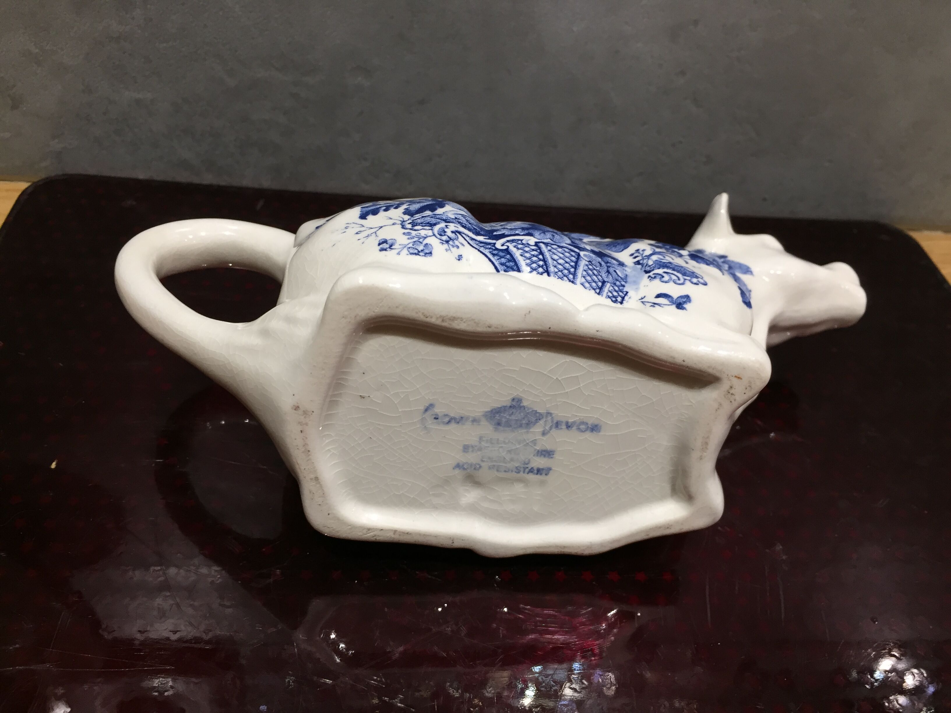English porcelain cow-shaped sauce dish