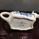 English porcelain cow-shaped sauce dish