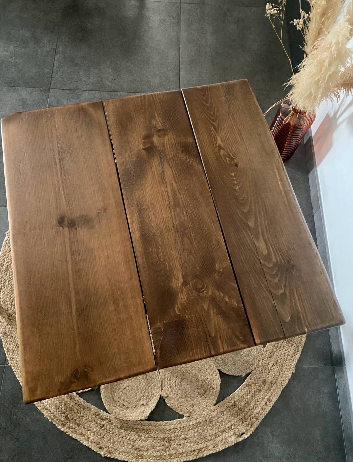 Bistro table with iron legs and raw wood top.