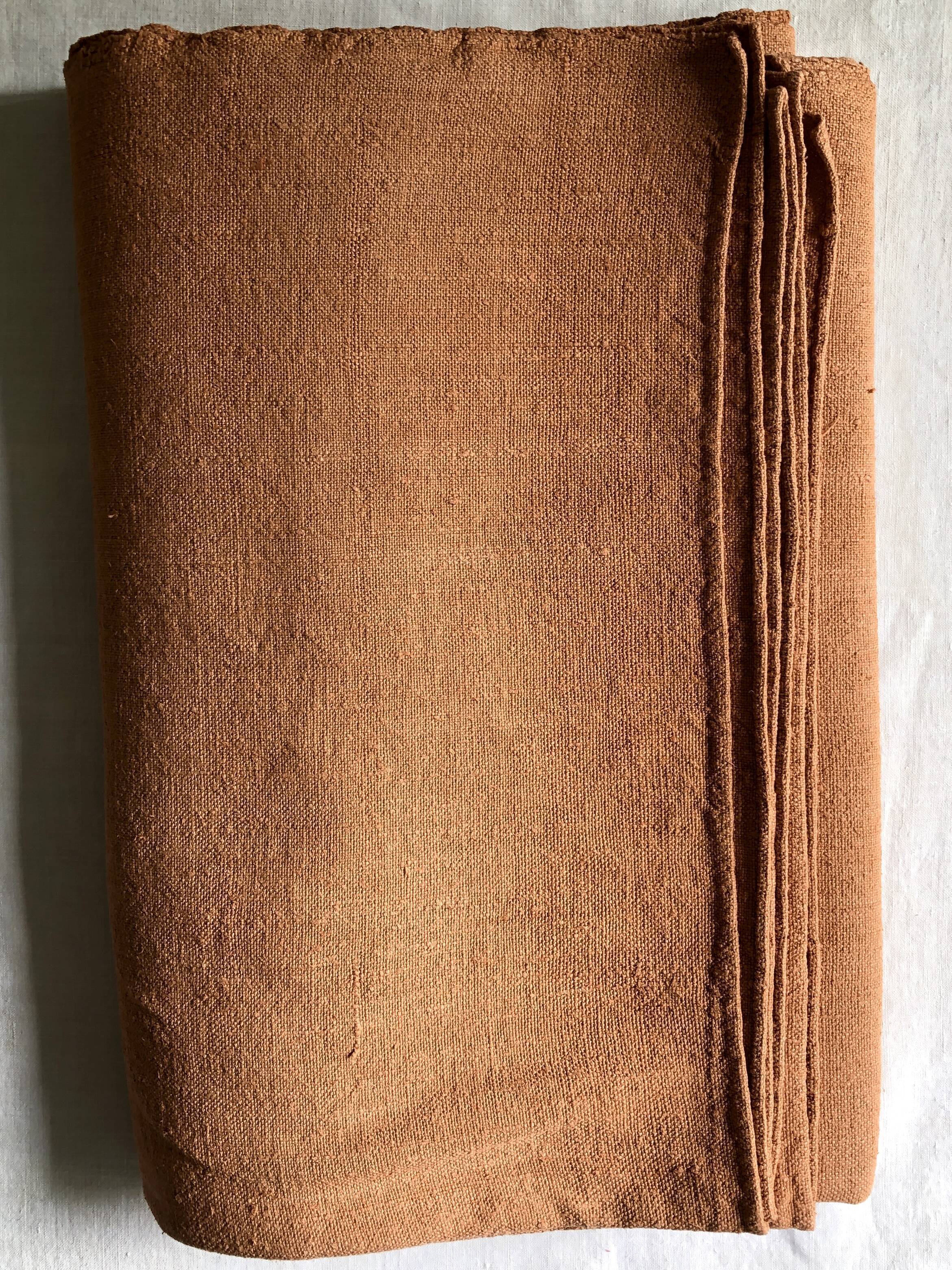 Old harvest tablecloth in terracotta tinted hemp