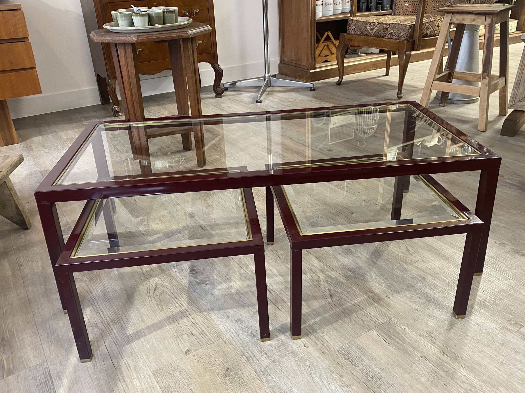 Burgundy lacquered metal, brass and beveled glass nesting tables, France 1950s