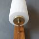 1960 wall light in gilded brass and rosewood.