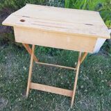 Children's desk with crossed legs