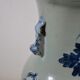 China. Porcelain mallet vase with blue and white phoenix decoration on a rock.
