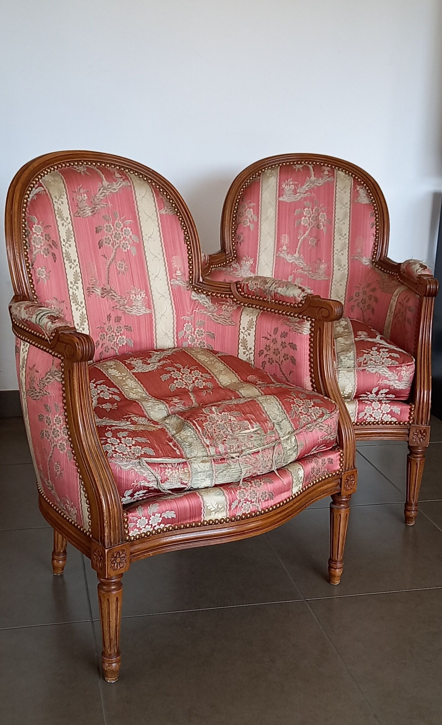 Pair of Louis XVI style armchairs in walnut and pink silk and ecru