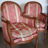 Pair of Louis XVI style armchairs in walnut and pink silk and ecru