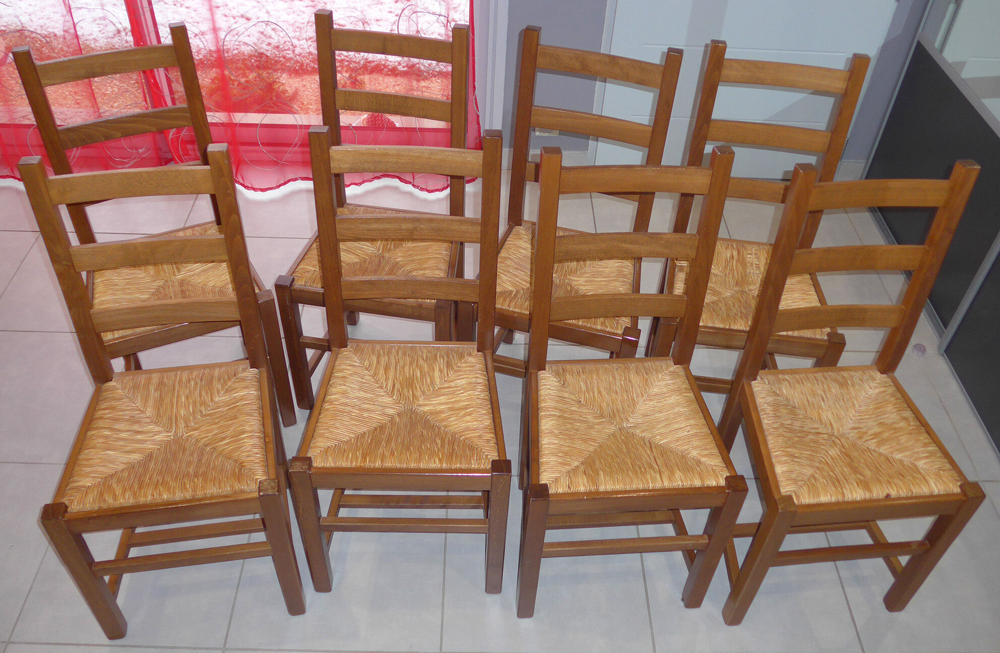 8 wooden chairs, straw seat
