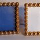 Pair of art deco photo frames in gilded bronze and gilded brass