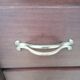 Small wooden veneer Art Deco chest of drawers.