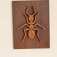 Plaque décorative en bois avec motif d'insecte