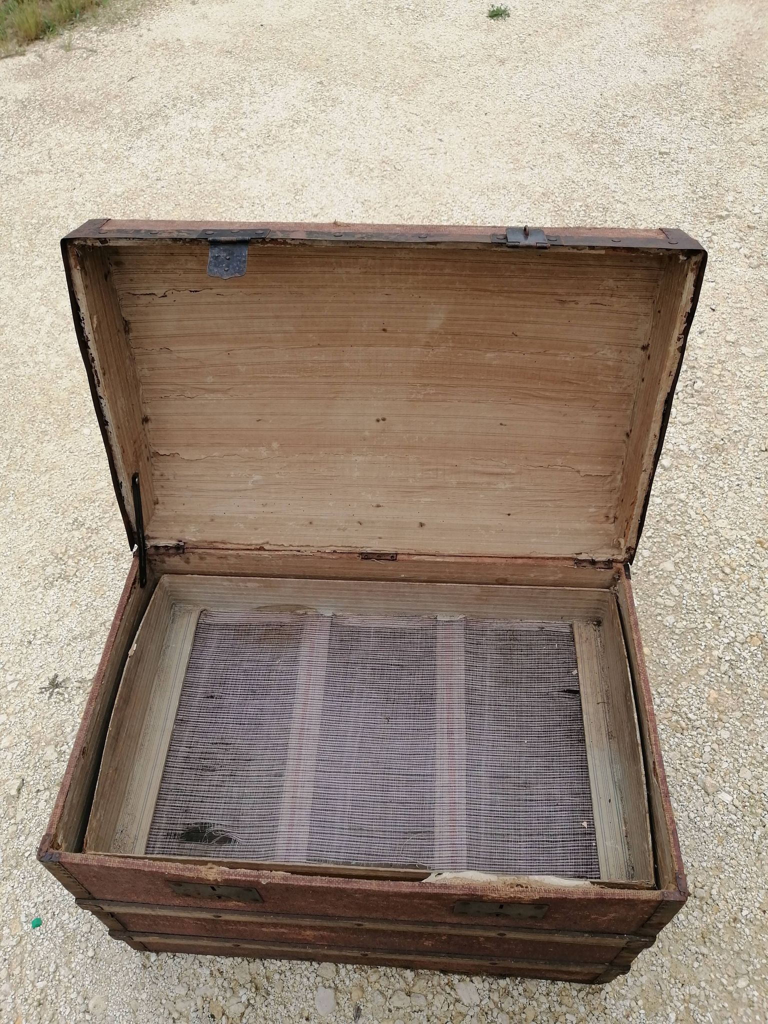 Old bombed travel trunk