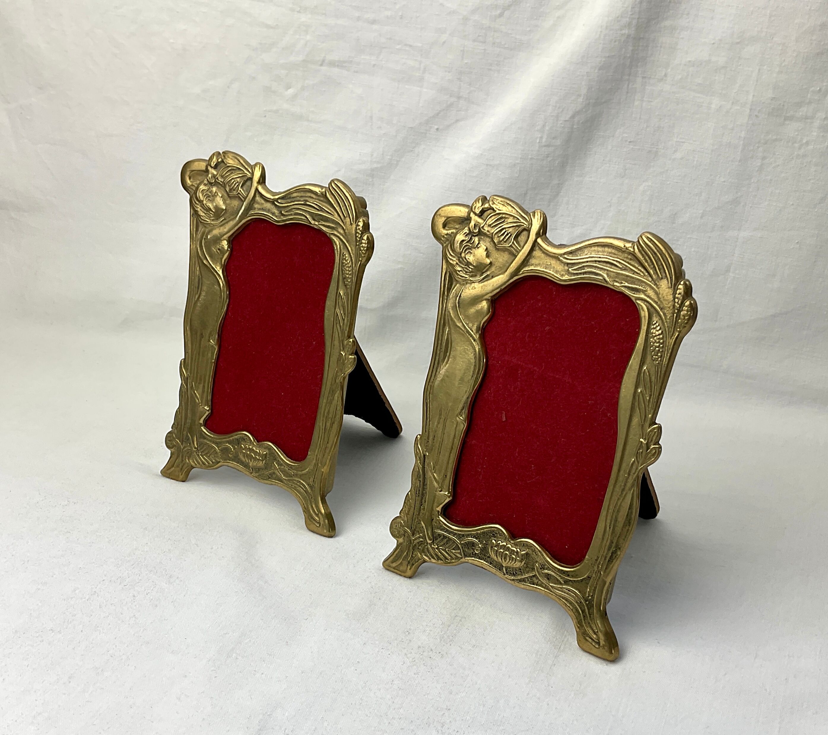 Pair of brass frames with Art Nouveau style woman