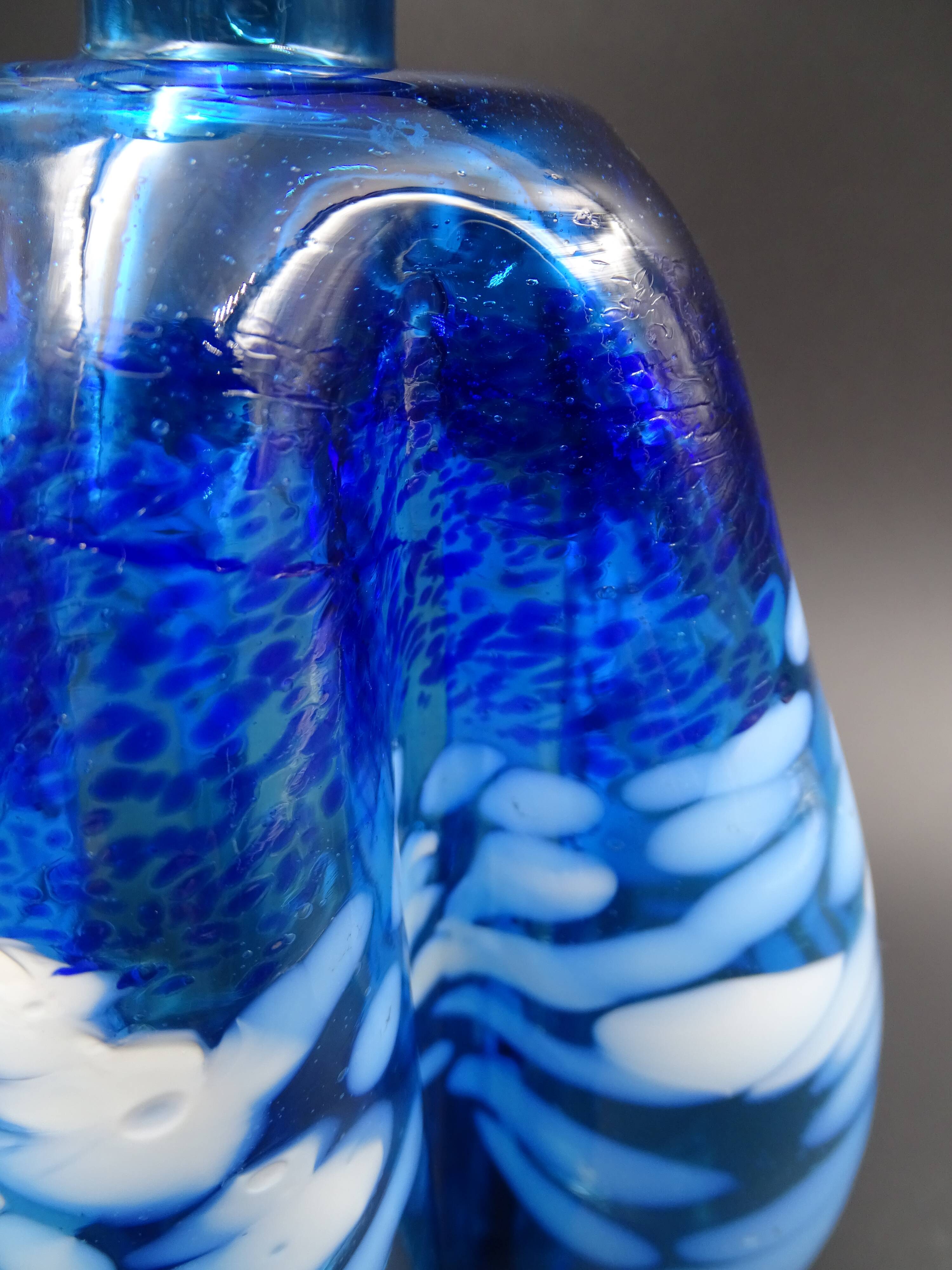 Blue glass vase and touches of white