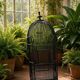 Old black metal birdcage from the early 20th century.