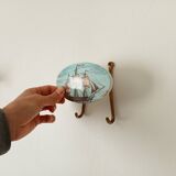 Vintage wall coat hook in brass and Bakelite.