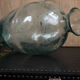 Old blown glass bottle, amphora-shaped