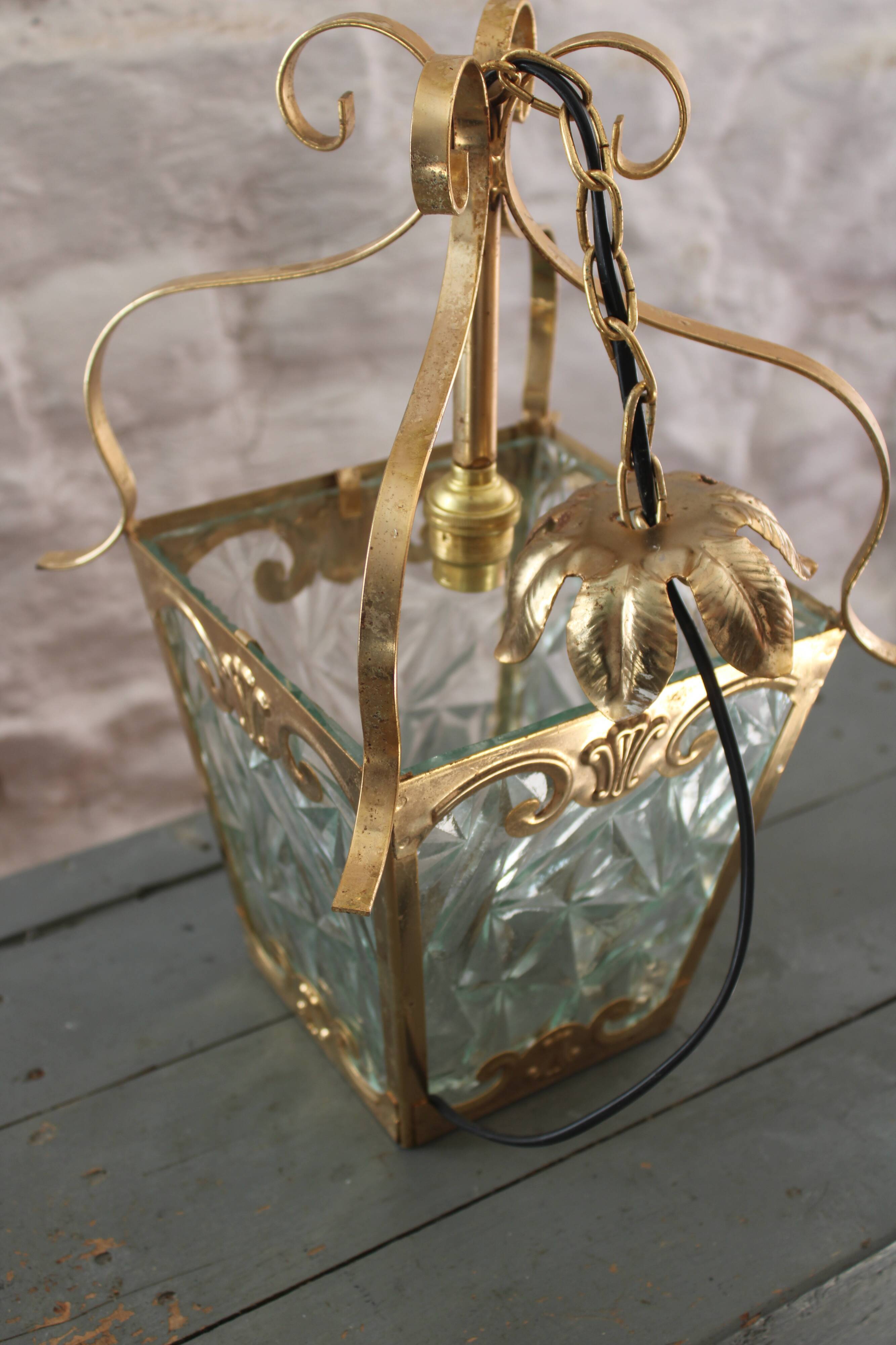 Glass and brass suspension