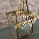 Glass and brass suspension