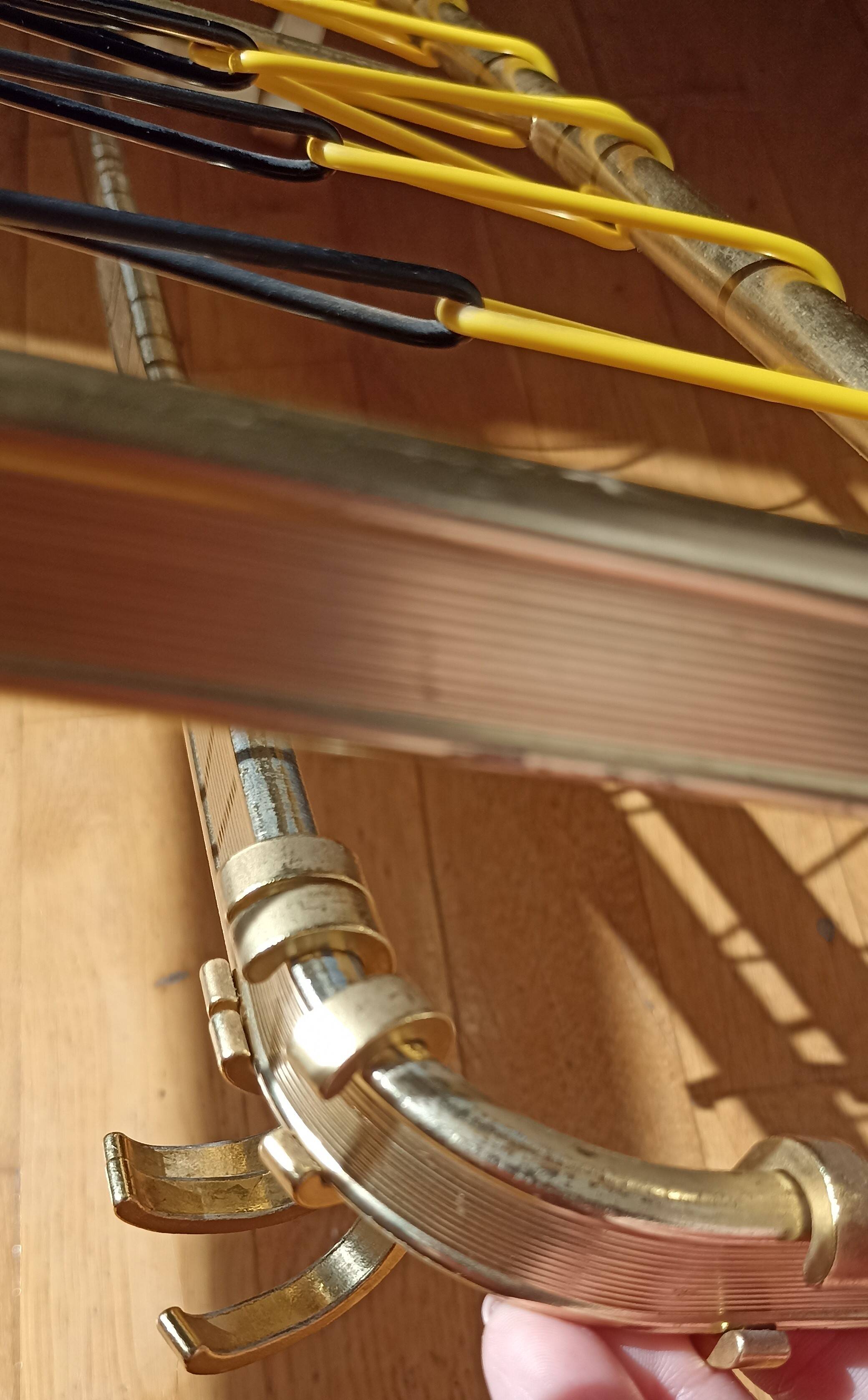 Gold metal wall coat rack