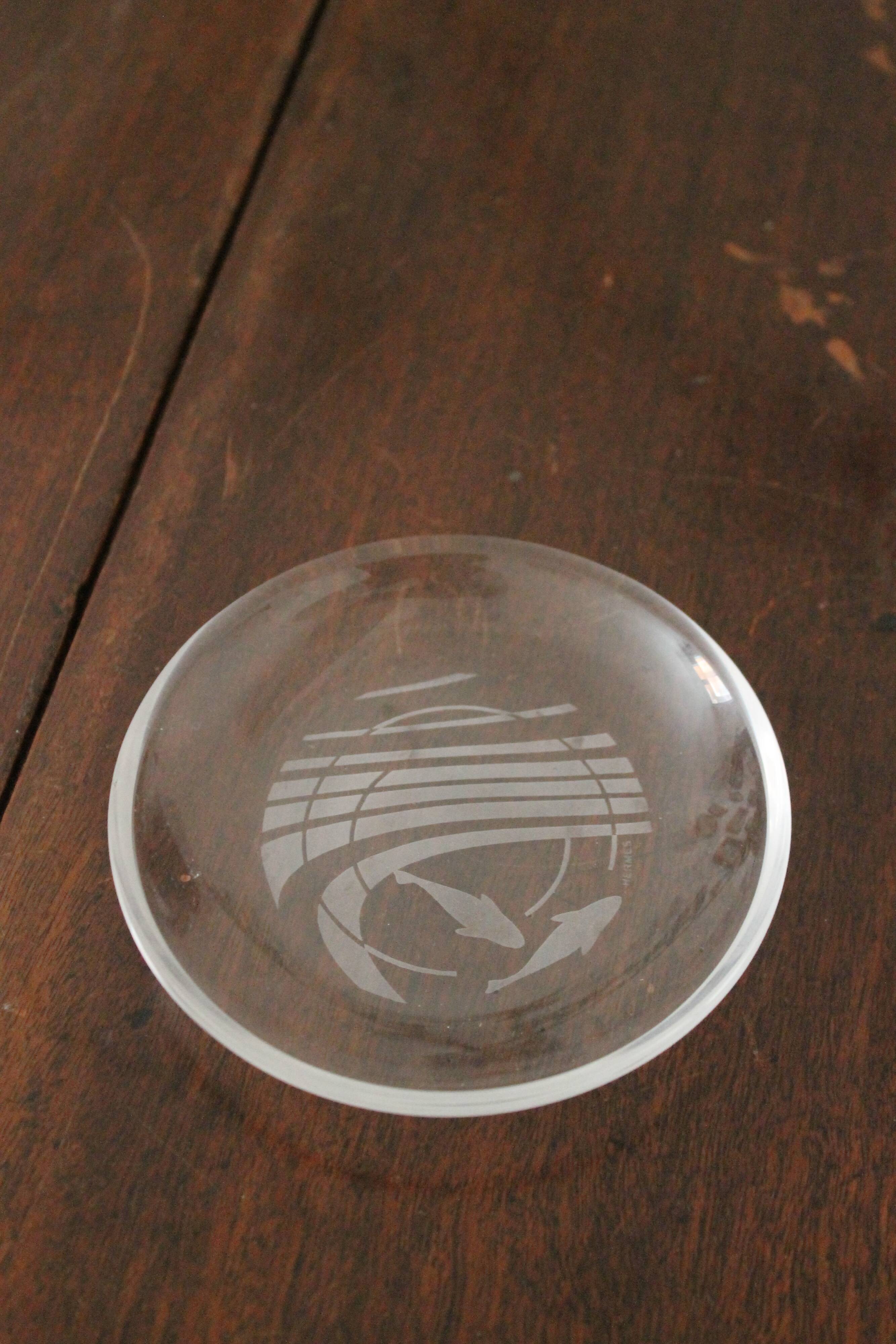 Hermès pair of glass plates with a dolphin pattern.