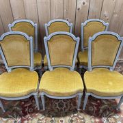 Set of 6 Louis XVI style chairs with polished wood and velvet.