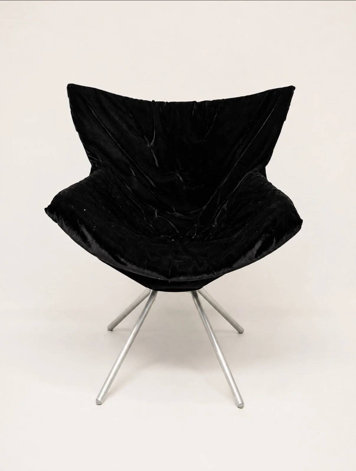 Vintage black velvet swivel lounge chair, sculptural butterfly shape.