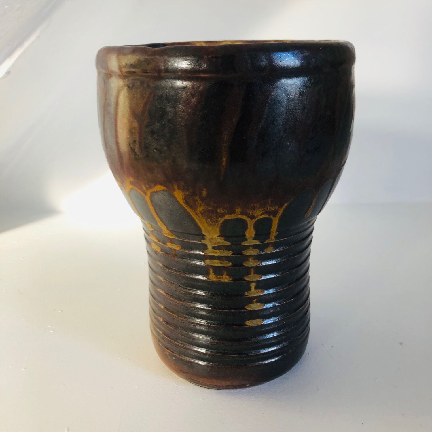 Metallic brown ceramic torso vase